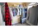 Walk-in closet featuring ample hanging space and storage shelves for organized wardrobe at 760 King Sword Ct, Mableton, GA 30126