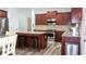 Well-lit kitchen features stainless steel appliances, granite countertops, and an island with barstool seating at 760 King Sword Ct, Mableton, GA 30126