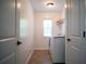 Well-lit laundry room featuring modern appliances, neutral tones, and plenty of space at 760 King Sword Ct, Mableton, GA 30126