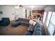 Open-concept floor plan featuring a living room with a comfortable sofa connected to the kitchen and dining area at 760 King Sword Ct, Mableton, GA 30126