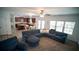 Spacious open concept living space featuring the kitchen, dining area, and living room with large windows at 760 King Sword Ct, Mableton, GA 30126