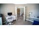 Bright office space with a desk, chair, neutral walls, and white trim with open view from french doors at 760 King Sword Ct, Mableton, GA 30126