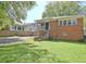 Quaint brick home featuring a screened porch and a spacious, well-maintained backyard at 78 Atlanta Se Ave, Atlanta, GA 30315