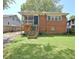 Quaint brick home featuring a screened porch and a spacious, well-maintained backyard at 78 Atlanta Se Ave, Atlanta, GA 30315
