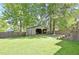 Lush backyard with a shed, mature trees, and a grassy lawn, creating a serene and private outdoor space at 78 Atlanta Se Ave, Atlanta, GA 30315