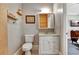 Well-lit bathroom showcasing a toilet, vanity, mirrored medicine cabinet, and access to the bedroom at 78 Atlanta Se Ave, Atlanta, GA 30315