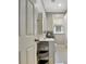 Bright bathroom with white tile floors, modern vanity, and window for natural light at 78 Atlanta Se Ave, Atlanta, GA 30315