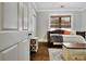 Bright bedroom with a daybed, a small storage table, a wooden table, and a window at 78 Atlanta Se Ave, Atlanta, GA 30315