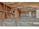 View of crawlspace with dirt flooring and plastic covering, and brick foundation at 78 Atlanta Se Ave, Atlanta, GA 30315