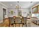 Elegant dining room with a chandelier, stylish chairs, and a view into the kitchen at 78 Atlanta Se Ave, Atlanta, GA 30315