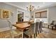 Cozy dining room with a wooden table, elegant chandelier, and comfortable seating at 78 Atlanta Se Ave, Atlanta, GA 30315