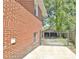 Brick exterior of a home with a gated backyard, offering privacy and security at 78 Atlanta Se Ave, Atlanta, GA 30315