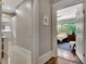 Hallway that connects the bathroom with natural lighting and a bedroom with wood flooring at 78 Atlanta Se Ave, Atlanta, GA 30315
