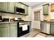 Well-appointed kitchen featuring stainless steel appliances, stylish cabinetry and great countertop space at 78 Atlanta Se Ave, Atlanta, GA 30315