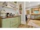 View of updated kitchen with stainless steel appliances, attractive cabinetry, light countertops, and open shelving at 78 Atlanta Se Ave, Atlanta, GA 30315