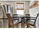 Cozy kitchen nook featuring wicker chairs, round glass table, and stainless steel refrigerator at 78 Atlanta Se Ave, Atlanta, GA 30315