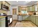 Well-appointed kitchen featuring stainless steel appliances, stylish cabinetry and great countertop space at 78 Atlanta Se Ave, Atlanta, GA 30315