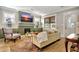 Stylish living room with a fireplace, built-ins, large windows, and a comfortable sofa at 78 Atlanta Se Ave, Atlanta, GA 30315