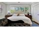 This main bedroom features a decorative headboard and an abundance of natural light at 78 Atlanta Se Ave, Atlanta, GA 30315