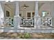 Close-up of a charming front porch with white columns and decorative railing, perfect for relaxing at 78 Atlanta Se Ave, Atlanta, GA 30315