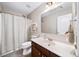 Well-lit bathroom featuring a shower/tub combo and a vanity with a single sink at 149 Manor Ln, Woodstock, GA 30188
