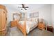 Bedroom with neutral color scheme and a wooden dresser and a large comfy bed at 149 Manor Ln, Woodstock, GA 30188