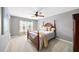 Bedroom with a four-poster bed, soft lighting, and a large window at 149 Manor Ln, Woodstock, GA 30188