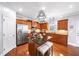 Modern kitchen with granite countertops, stainless steel appliances, an island, and ample cabinet space at 149 Manor Ln, Woodstock, GA 30188