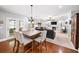 Cozy living room features hardwood floors, a fireplace, and built-in shelving, ideal for relaxation and entertainment at 149 Manor Ln, Woodstock, GA 30188