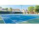 Community tennis court surrounded by lush greenery and well maintained at 149 Manor Ln, Woodstock, GA 30188