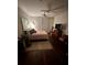 Cozy bedroom with neutral tones, hardwood floors, and a ceiling fan for comfortable living at 200 Renaissance Ne Pkwy # 305, Atlanta, GA 30308