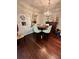 Dining room boasts hardwood floors, decorative mirror and chandelier, and seating for four at 200 Renaissance Ne Pkwy # 305, Atlanta, GA 30308
