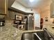 Spacious kitchen featuring granite counters, stainless steel appliances, and hardwood floors at 200 Renaissance Ne Pkwy # 305, Atlanta, GA 30308
