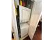 A compact laundry area with a stacked washer and dryer unit for efficient use of space at 200 Renaissance Ne Pkwy # 305, Atlanta, GA 30308