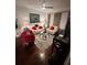 Well-lit living room is complete with stylish decor, hardwood floors, and a modern ceiling fan at 200 Renaissance Ne Pkwy # 305, Atlanta, GA 30308