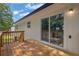 Inviting back deck with wooden railings offers beautiful views of the surrounding wooded area at 2184 Cherokee Valley Cir, Lithonia, GA 30058