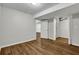 Neutral basement featuring wood-look floors and white closet doors at 2184 Cherokee Valley Cir, Lithonia, GA 30058