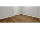 Finished basement with wood-look floors, white trim, and neutral paint at 2184 Cherokee Valley Cir, Lithonia, GA 30058