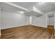 Expansive finished basement showcasing wood-look floors and a neutral color palette at 2184 Cherokee Valley Cir, Lithonia, GA 30058