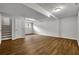 Spacious finished basement featuring wood-look floors, neutral paint, and ample natural light at 2184 Cherokee Valley Cir, Lithonia, GA 30058