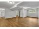Large, finished basement with wood-look floors, painted walls, and recessed lighting at 2184 Cherokee Valley Cir, Lithonia, GA 30058