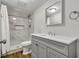 Elegant bathroom with a tiled shower, modern vanity, and neutral color scheme at 2184 Cherokee Valley Cir, Lithonia, GA 30058