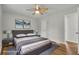 Bedroom virtually staged with decor and furnishings, wood-look flooring, and a ceiling fan at 2184 Cherokee Valley Cir, Lithonia, GA 30058