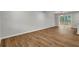 Bright dining area with hardwood floors and sliding glass doors to deck, offering natural light at 2184 Cherokee Valley Cir, Lithonia, GA 30058