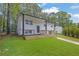 An inviting home with clean lines, complemented by lush green grass at 2184 Cherokee Valley Cir, Lithonia, GA 30058