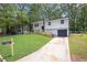 This angle showcases the property's charming exterior, complete with a well-manicured lawn at 2184 Cherokee Valley Cir, Lithonia, GA 30058