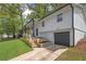 Charming home with a well-manicured lawn, a black garage door, and a stone foundation at 2184 Cherokee Valley Cir, Lithonia, GA 30058