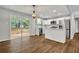 Bright, open kitchen with stainless steel appliances and an island, flowing into living space at 2184 Cherokee Valley Cir, Lithonia, GA 30058