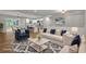 Open-concept living and kitchen area with dining space, featuring modern decor and furnishings at 2184 Cherokee Valley Cir, Lithonia, GA 30058