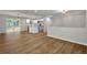 Open floor plan showcasing kitchen with stainless appliances, island, and hardwood floors at 2184 Cherokee Valley Cir, Lithonia, GA 30058